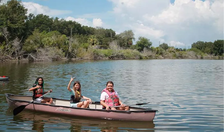 Children canoe at Camp Cristina YMCA.