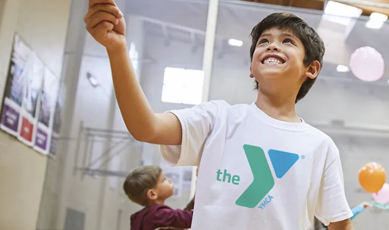 Child enjoying our Y gymnasium.
