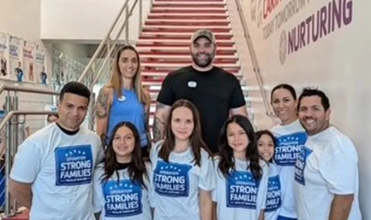 MSgt Rosmell MejiaEscobar, USMC, first from left and Major Araceli  Macias can be seen second from right - with their families.